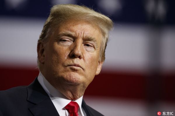 President Donald Trump listens during a campaign rally at Florida State Fairgrounds Expo Hall, Tuesday, July 31, 2018, in Tampa, Florida. [Photo: IC]