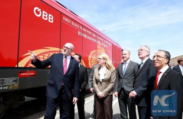 Austrian President Alexander Van der Bellen (2nd R Front), Austrian Minister for Digital and Economic Affairs Margarete Schrambock (4th R, Front), Chinese Ambassador to Austria Li Xiaosi (1st R, Front) and other guests inspect a new China-Europe freight train from Chengdu to Vienna at the Vienna South Freight Center in Vienna, Austria, on April 27, 2018. With the new train, Austria is included into the network of China-Europe freight train service under the Belt and Road Initiative. [Photo: Xinhua]